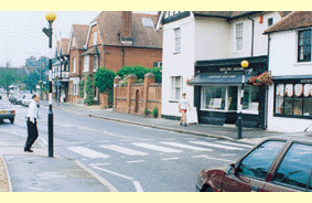 What should the driver of the car approaching the crossing do? - What should the driver of the car approaching the crossing do?