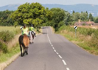 What should you do when you see these horse riders in front? - What should you do when you see these horse riders in front?